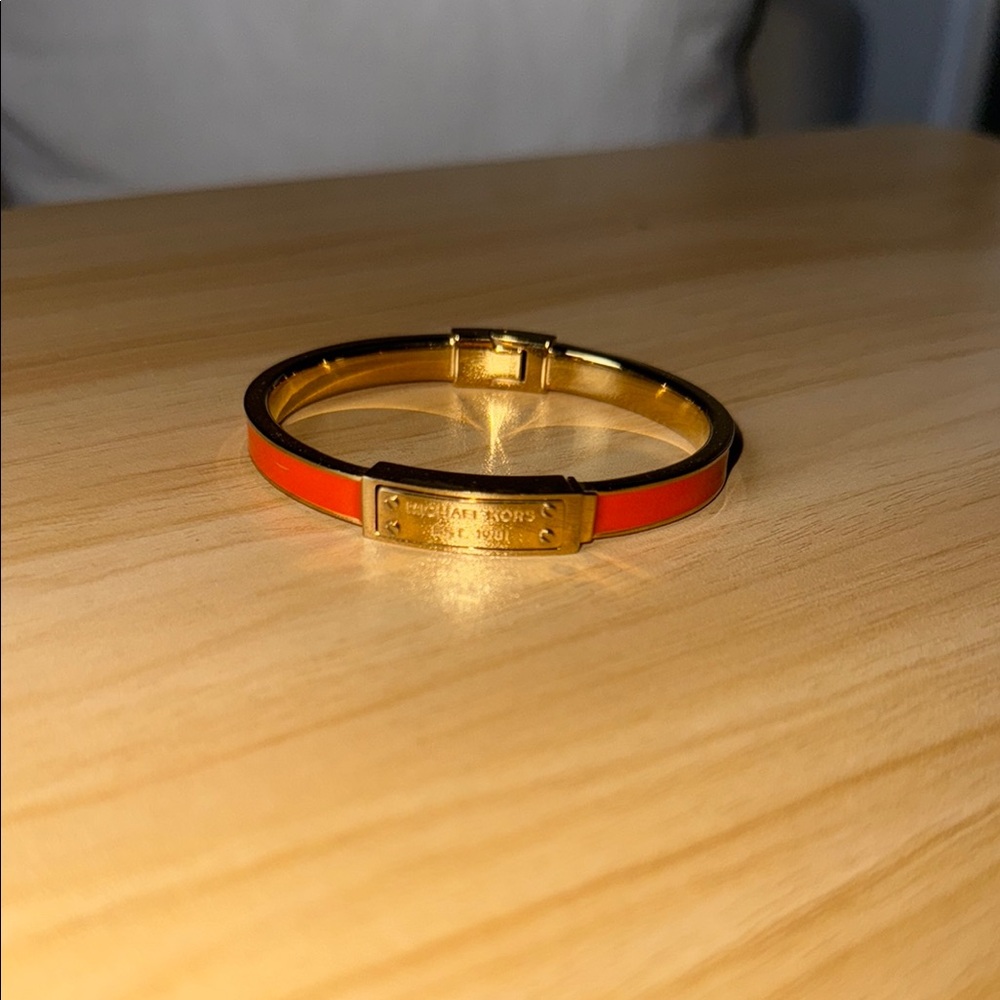 Michael Kors Orange and Gold Bracelet with Sleek Design